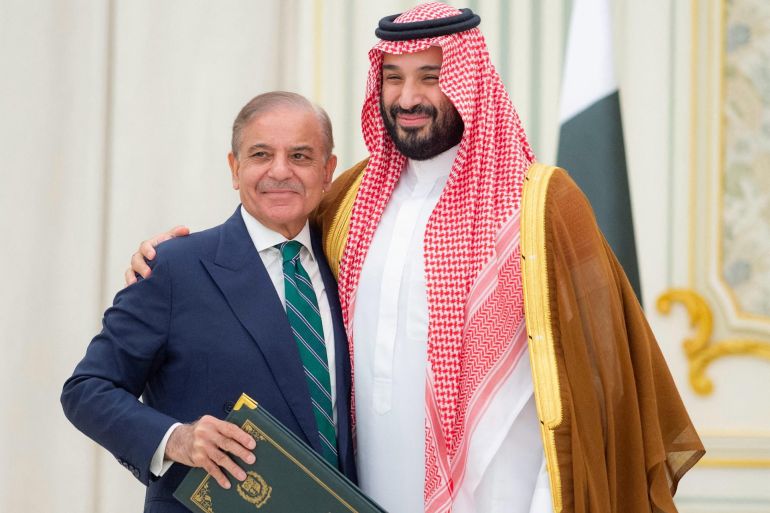 Saudi Crown Prince Mohammed bin Salman and Pakistan Prime Minister Shehbaz Sharif embrace each other on the day they sign a defence agreement, in Riyadh, Saudi Arabia, September 17, 2025. Saudi Press Agency/Handout via REUTERS THIS IMAGE HAS BEEN SUPPLIED BY A THIRD PARTY.