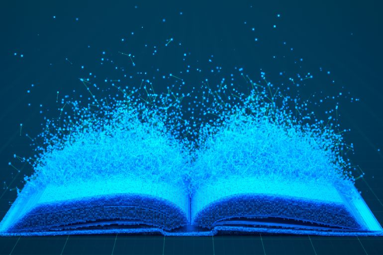 An open book dissolves into a network of glowing blue particles against a dark background. Concept for digital transformation, online education, and information technology.