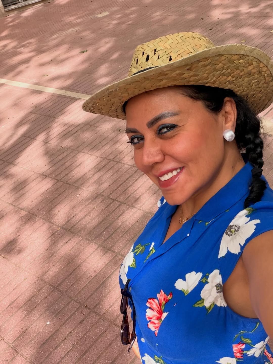 May be an image of smiling and hat