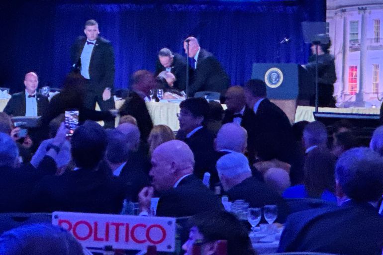 Secret service agents respond during the White House Correspondents Dinner, Saturday, April 25, 2026, in Washington. (AP Photo/Mark Schiefelbein)