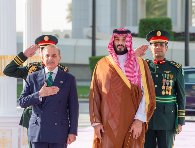 A handout picture provided by the Saudi Press Agency (SPA) on September 17, 2025, shows Saudi Arabia's Crown Prince Mohammed bin Salman (R) welcoming Pakistan's Prime Minister Shehbaz Sharif ahead of their meeting in Riyadh.