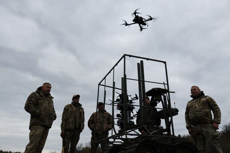 In this handout photograph taken and released by the press service of the 65th Mechanized Brigade of Ukrainian Armed Forces on April 10, 2026, Ukrainian servicemen test a FPV drone during a training at an undisclosed location in Zaporizhzhia region, amid the Russian invasion of Ukraine.