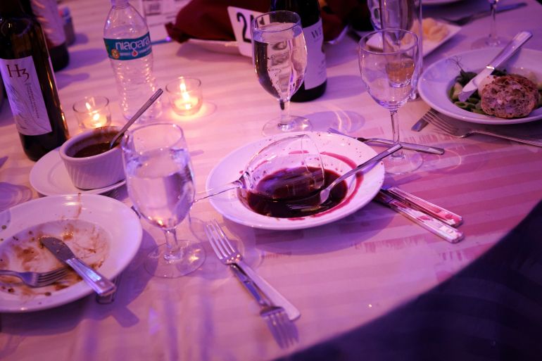 An abandoned wine glass sits in a bowl after an incident occurred at the White House Correspondents Dinner at the Washington Hilton, Saturday, April 25, 2026, in Washington. (AP Photo/Tom Brenner)