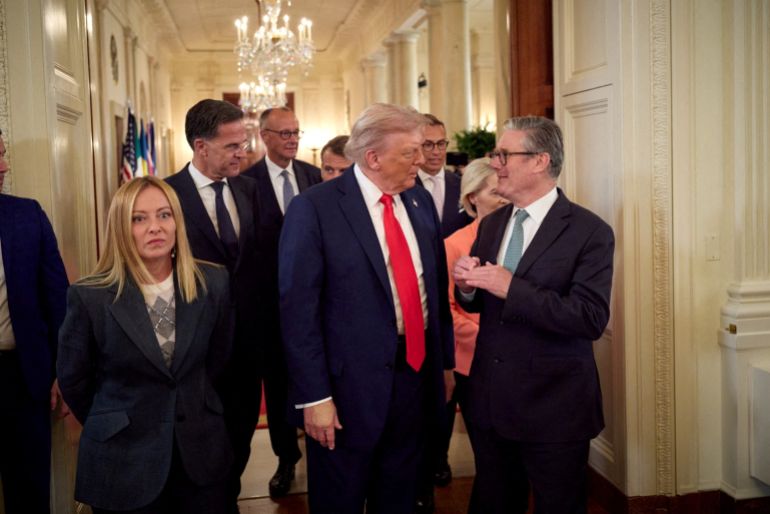 FILE PHOTO: U.S. President Donald Trump talks with British Prime Minister Keir Starmer next to French President Emmanuel Macron, Italian Prime Minister Giorgia Meloni, European Commission President Ursula von der Leyen, NATO Secretary General Mark Rutte, Finland's President Alexander Stubb and German Chancellor Friedrich Merz as they walk during a meeting, amid negotiations to end the Russian war in Ukraine with Ukrainian President Volodymyr Zelenskiy (not pictured), at the White House in Washington, D.C., U.S., August 18, 2025. Ukrainian Presidential Press Service/Handout via REUTERS ATTENTION EDITORS - THIS IMAGE HAS BEEN SUPPLIED BY A THIRD PARTY./File Photo