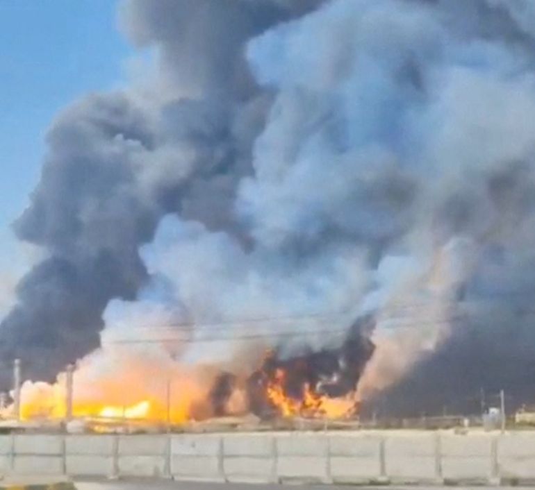 Smoke and fire rise near the South Pars gas field following an attack, amid the U.S.-Israeli conflict with Iran, in Bushehr Province, Iran, March 18, 2026, in this screengrab obtained from a social media video. Social Media/via REUTERS THIS IMAGE HAS BEEN SUPPLIED BY A THIRD PARTY. NO RESALES. NO ARCHIVES. NEWS ONLY USE. VERIFICATION: Reuters confirmed the location from the road layout, light house, electric pylons, and ship model. Reuters could not confirm the date of footage, however Iran's Fars news agency reported that gas tanks and parts of a refinery had been hit and state media later said the fire there was under control. No older versions of the video were found before March 18. Coordinates of the structures under fire was seen from 27.525170402738087, 52.572015374827416. NASA FIRMS detected thermal activity in the vicinity on March 18. Iranian gas flows to Iraq were halted on Wednesday following an attack on Iran's Pars gas field, a senior Iraqi official told Reuters.