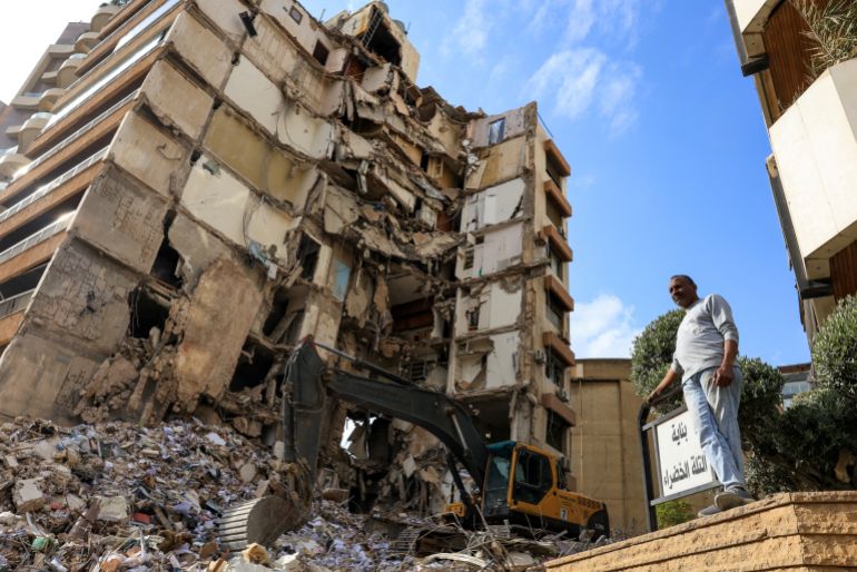 A man stands near a damaged building at the site of an Israeli strike carried out on Wednesday, in Tallet El Khayat in Beirut, Lebanon, April 9, 2026. REUTERS/Raghed Waked TPX IMAGES OF THE DAY