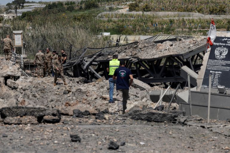 Members of the Lebanese army work at the site after an Israeli strike severed the last remaining bridge linking southern Lebanon to the rest of the country, in Qasmiyeh, Lebanon April 16, 2026. REUTERS/Louisa Gouliamaki