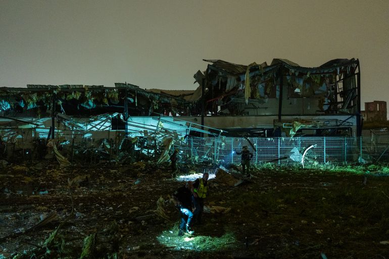PETAH TIKVA, ISRAEL - APRIL 2: Emergency crews inspect damage after an Iranian ballistic missile struck an industrial area on April 2, 2026 in Petah Tikva, Israel. Iran has continued firing waves of drones and missiles at Israel after the United States and Israel launched a joint attack on Iran early on February 28th. (Photo by Erik Marmor/Getty Images)