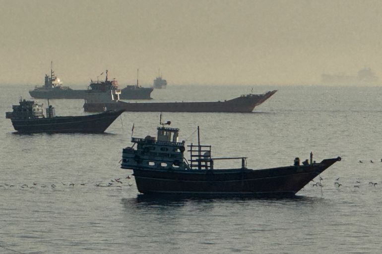 Vessels are seen anchored in the Strait of Hormuz, off the port city of Khasab on Oman’s northern Musandam Peninsula on May 17, 2026.