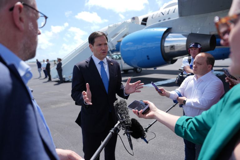 US Secretary of State Marco Rubio speaks to the press before boarding his plane at Homestead Air Reserve Base on May 21, 2026 in Homestead, Florida.