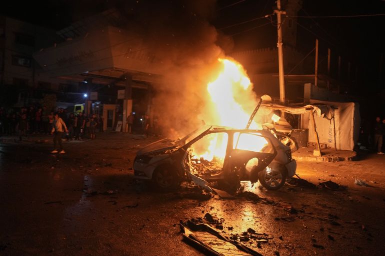Flames engulf a vehicle struck by an Israeli strike in a street of Gaza City, Friday, May 15, 2026. (AP Photo/Jehad Alshrafi)