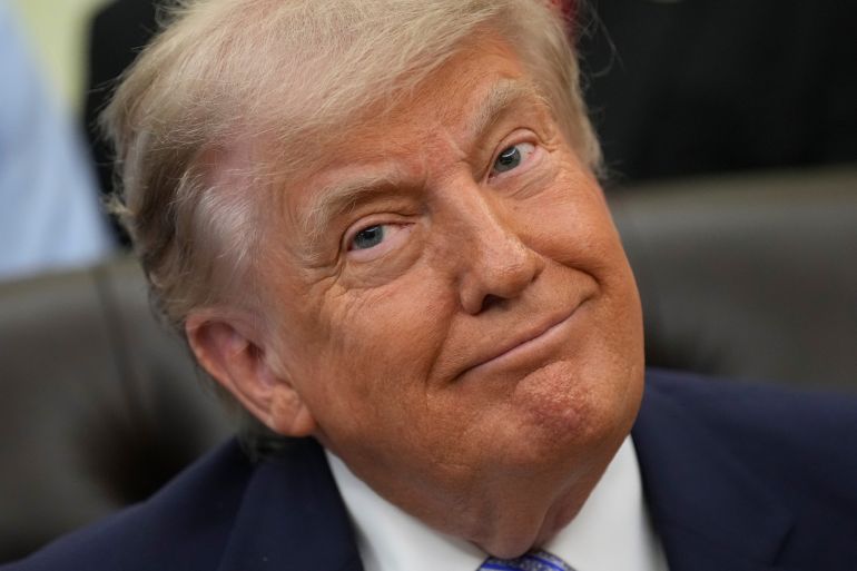 President Donald Trump attends an event about loosening a federal refrigerant rule, in the Oval Office at the White House, Thursday, May 21, 2026, in Washington. (AP Photo/Jacquelyn Martin)