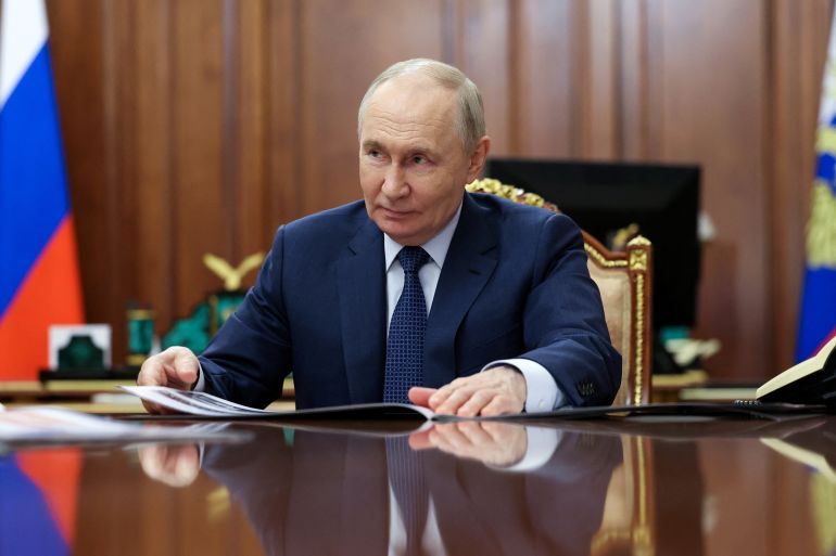 Russian President Vladimir Putin attends a meeting with General Director of KAMAZ truck manufacturer Sergei Kogogin in Moscow, Russia, May 5, 2026. Sputnik/Mikhail Metzel/Pool via REUTERS ATTENTION EDITORS - THIS IMAGE WAS PROVIDED BY A THIRD PARTY.