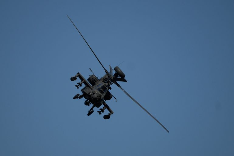 An Apache helicopter flies as soldiers take part in the U.S.-led Immediate Response 25 military exercise in Petrochori, northern Greece Wednesday, June 4, 2025. (AP Photo/Thanassis Stavrakis)