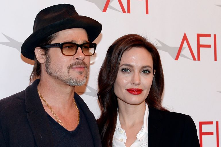 Actor Brad Pitt and actress/director Angelina Jolie pose at the AFI Awards 2014 honoring excellence in film and television in Beverly Hills, California on January 9, 2015. REUTERS/Kevork Djansezian (UNITED STATES - Tags: ENTERTAINMENT)