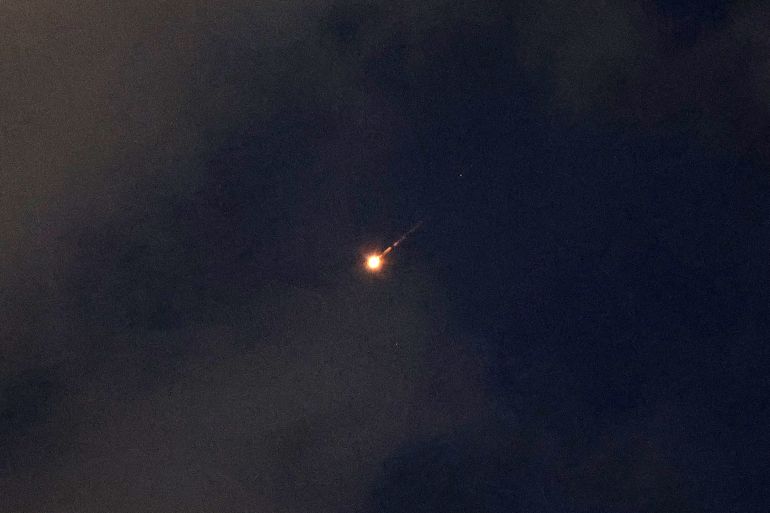A rocket trail is seen in the sky above the Israeli coastal city of Netanya on June 7, 2026.