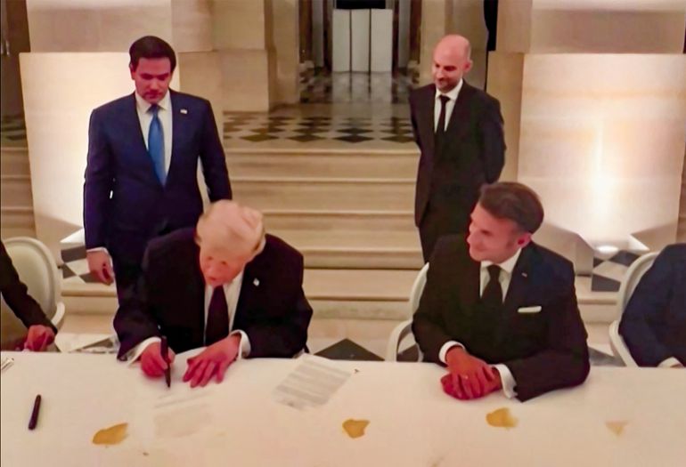 This videograb from footage made available on June 18, 2026, from the X account of French President Emmanuel Macron shows US President Donald Trump (L) and France's President Emmanuel Macron (R) during the signing of a deal with Iran to end the Middle East war, inside Chateau de Versailles, in Versailles southwest of Paris on June 17, 2026. (Photo by @EmmanuelMacron (X account of France's President Emmanuel Macron) / AFP) / NO USE AFTER JULY 17, 2026 22:00:00 GMT - XGTY - RESTRICTED TO EDITORIAL USE - MANDATORY CREDIT « AFP PHOTO / @EMMANUELMACRON » - NO MARKETING NO ADVERTISING CAMPAIGNS - DISTRIBUTED AS A SERVICE TO CLIENTS - NO ARCHIVE