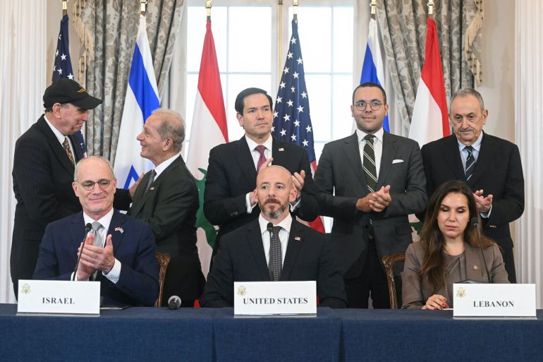 US Secretary of State Marco Rubio (C, back) applauds as he hosts a signing ceremony with Israeli Ambassador to the US Yechiel Leiter (L, front row), and Lebanese Ambassador to the US Nada Hamadeh (R, front row) at the US Department of State in Washington, DC, on June 26, 2026.