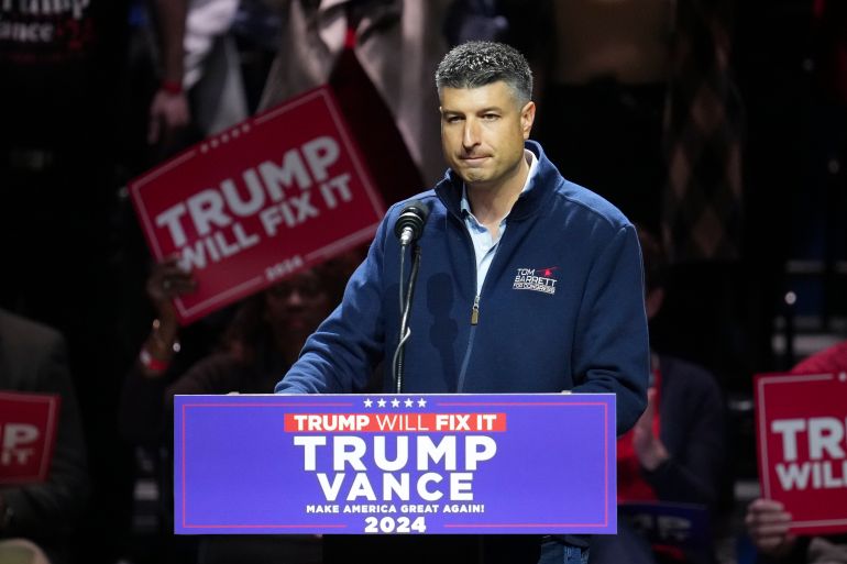 Tom Barrett, Republican candidate for Michigan's 7th Congressional District, speaks before Republican vice presidential nominee Sen. JD Vance, R-Ohio, arrives at during a campaign rally at FIM Capitol Theatre, Monday, Nov. 4, 2024, in Flint, Mich. (AP Photo/Paul Sancya)