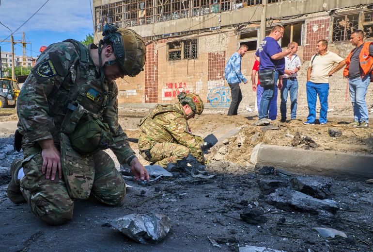 epa13072969 Ukrainian experts work at the site of a Russian glide bomb strike in Kharkiv, northeastern Ukraine, 29 June 2026, amid the Russian invasion. At least one person was killed and 12 others injured after Russian strikes hit the city, according to reports from the State Emergency Service of Ukraine. EPA/SERGEY KOZLOV