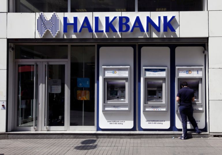 A customer uses an automated teller machine at a branch of Halkbank in Istanbul August 15, 2014. Turkey's state-run lender Halkbank said on Friday it has offer to buy a 76.76 percent stake in Serbian lender Cacanska Banka for an undisclosed sum. Halkbank offered no further details on the potential acquisition in a statement to the Istanbul stock exchange. REUTERS/Osman Orsal (TURKEY - Tags: BUSINESS)