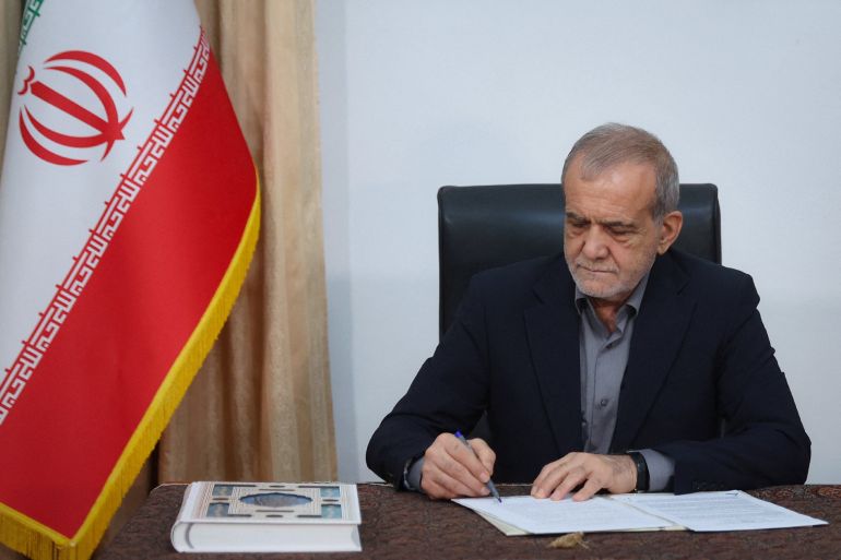 Iranian President Masoud Pezeshkian signs the document of U.S. Memorandum of Understanding in Tehran, Iran, June 18, 2026. Iran's Presidential website/WANA (West Asia News Agency)/Handout via REUTERS ATTENTION EDITORS - THIS PICTURE WAS PROVIDED BY A THIRD PARTY. ISRAEL OUT. NO COMMERCIAL OR EDITORIAL SALES IN ISRAEL. NO ACCESS FOR ISRAELI MEDIA. NO USE BBC PERSIAN. NO USE VOA PERSIAN. NO USE MANOTO. NO USE IRAN INTERNATIONAL. NO USE RADIO FARDA. DIGITAL: NO USE BBC PERSIAN. NO USE VOA PERSIAN. NO USE MANOTO. NO USE IRAN INTERNATIONAL. NO USE RADIO FARDA.