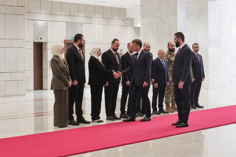 France's President Emmanuel Macron meets a delegation as Syrian President Ahmed Al-Sharaa receives Macron at the People's Palace in Damascus, Syria, July 7, 2026. REUTERS/Mahmoud Hassano