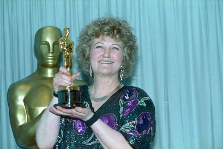 (Original Caption) Academy Awards, Los Angeles - Brenda Fricker holds up her Oscar after winning Best Supporting Actress for her role in My Left Foot March 26 at the 62nd Academy Awards.