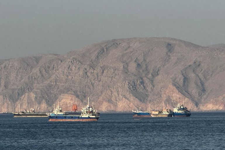 (FILES) Vessels are seen anchored in the Strait of Hormuz, off the port city of Khasab on Oman’s northern Musandam Peninsula on May 17, 2026.