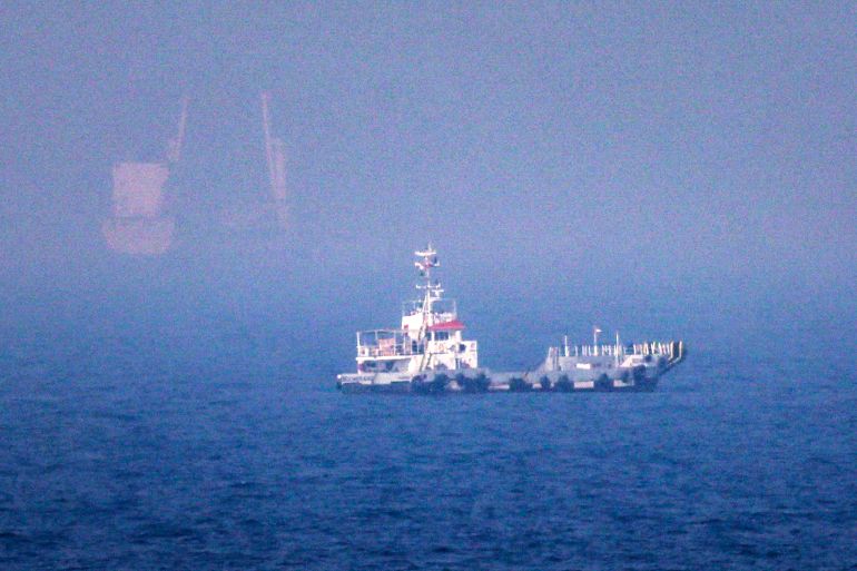 This picture shows ships sailing near the Strait of Hormuz off the eastern coast of the United Arab Emirates at Khor Fakkan on July 13, 2026.