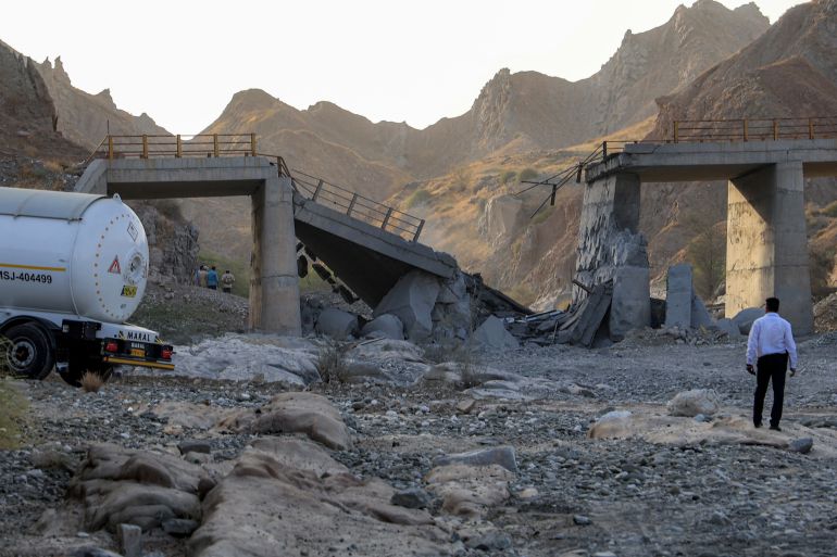 A heavily-damaged bridge which was hit by a US strike is pictured along the road connecting Roudan and Bandar Abbas in southern Iran on July 18, 2026.