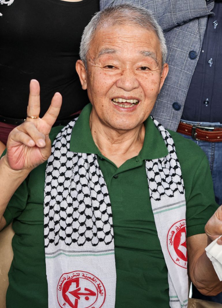 (FILES) Kozo Okamoto -- the only surviving member of the three-man "Japanese Red Army" (JRA) commando unit that killed 26 people in an attack on Israel's Lod airport on May 30, 1972 -- gestures as he attends a ceremony organised by Palestinian militants to mark the 50th anniversary of the Lod attack in Lebanon's capital Beirut on May 30, 2022.