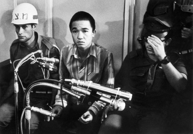 (FILES) This photo taken on July 10, 1972 shows Kozo Okamoto (C) -- the only surviving member of the three-man "Japanese Red Army" (JRA) commando unit that killed 26 people in an attack on Israel's Lod airport earlier on May 30 -- during the opening of his trial before a military tribunal at an undisclosed location in central Israel.