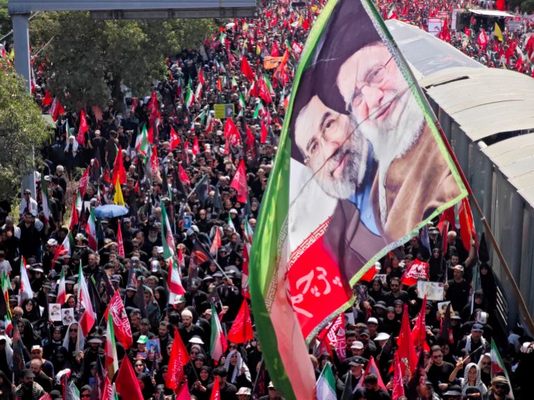 TEHRAN, IRAN - JULY 06: Mourners gather with flags to pay final respects to Iran's slain Supreme Leader Ayatollah Ali Khamenei during the third day of his funeral ceremonies on July 06, 2026 in Tehran, Iran. Khamenei and members of his family were killed on February 28 during U.S.-Israeli strikes at the beginning of the war, bringing an end to his 36-year rule over Iran. A multi-city state funeral will be held over six days before his body is laid to rest on July 9, in his hometown of Mashhad, Iran. (Photo by Majid Saeedi/Getty Images)