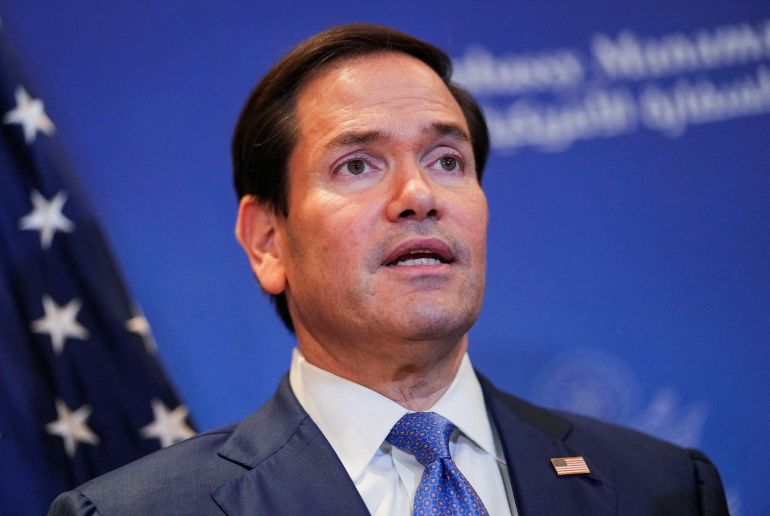FILE PHOTO: U.S. Secretary of State Marco Rubio speaks with members of the media before departing for Bahrain International Airport after his visit to the Middle East to discuss the interim deal between the U.S. and Iran with Arab Gulf allies, in Manama, Bahrain, June 25, 2026. REUTERS/Eric Lee/Pool/File Photo