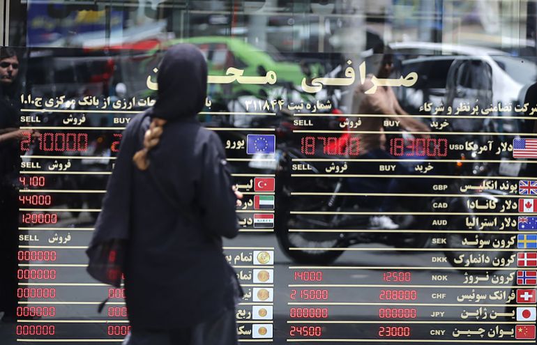TEHRAN, IRAN - MAY 4: Citizens of Iran are seen as the US dollar hits an all-time high on the open market as the national currency continues to depreciate sharply under the impact of heavy US sanctions and war-driven economic pressures, driving up prices of essential goods and affecting commercial activity across the country, on May 4, 2026, in Tehran, Iran. (Photo by Fatemeh Bahrami/Anadolu via Getty Images)