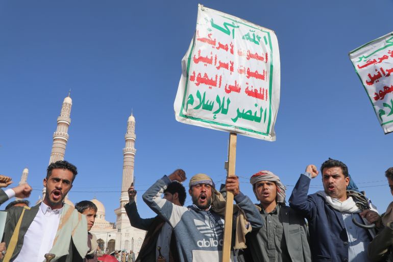 Supporters of Yemen's Houthi rebels shout slogans during a rally in support of the group, in Sanaa, Yemen, Friday, Oct. 9, 2026. The placard reads "God is great, death to America, death to Israel, Curse the Jews, Victory to Islam." (AP Photo/Osamah Abdulrahman)