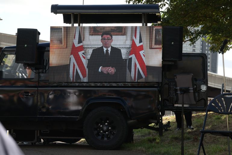 LONDON, ENGLAND - SEPTEMBER 11: Prime Minister Andy Burnham speaks via a video screen during the Commemoration of the 25th anniversary of 9/11 attacks at Queen Elizabeth Olympic Park on September 11, 2026 in London, England. The memorial event hosted by the educational charity SINCE 9/11 marks the 25th anniversary of the terror attacks, and is being held at the site of the SINCE 9/11 sculpture, a 28ft artwork constructed of steel from the World Trade Center recovered from Ground Zero in New York. The terror attacks on September 11, 2001 killed 2,977 people, including 67 British citizens. (Photo by Dan Kitwood/Getty Images)